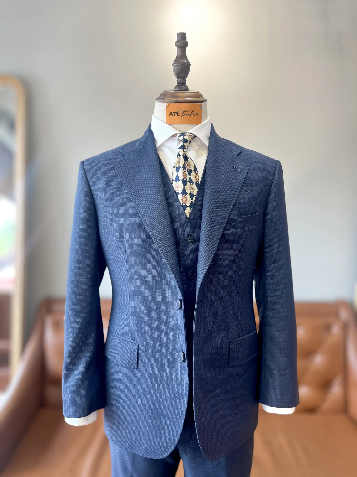 Made-to-measure navy three-piece suit made by ATL Apparel Factory